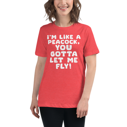 "I'm like a peacock, you gotta let me fly!" printed on a heather red women's relaxed t-shirt worn by a female