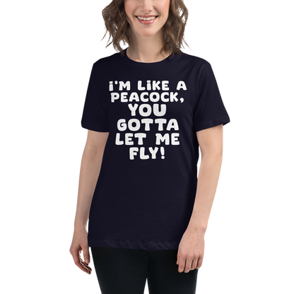 "I'm like a peacock, you gotta let me fly!" printed on a navy women's relaxed t-shirt worn by a female