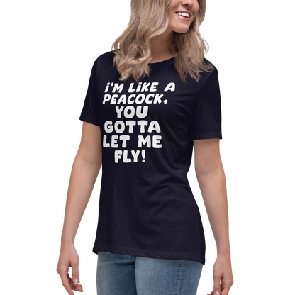 "I'm like a peacock, you gotta let me fly!" printed on a navy women's relaxed t-shirt worn by a female