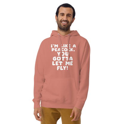 "I'm like a peacock, you gotta let me fly!" printed on a dusty rose warn by a male