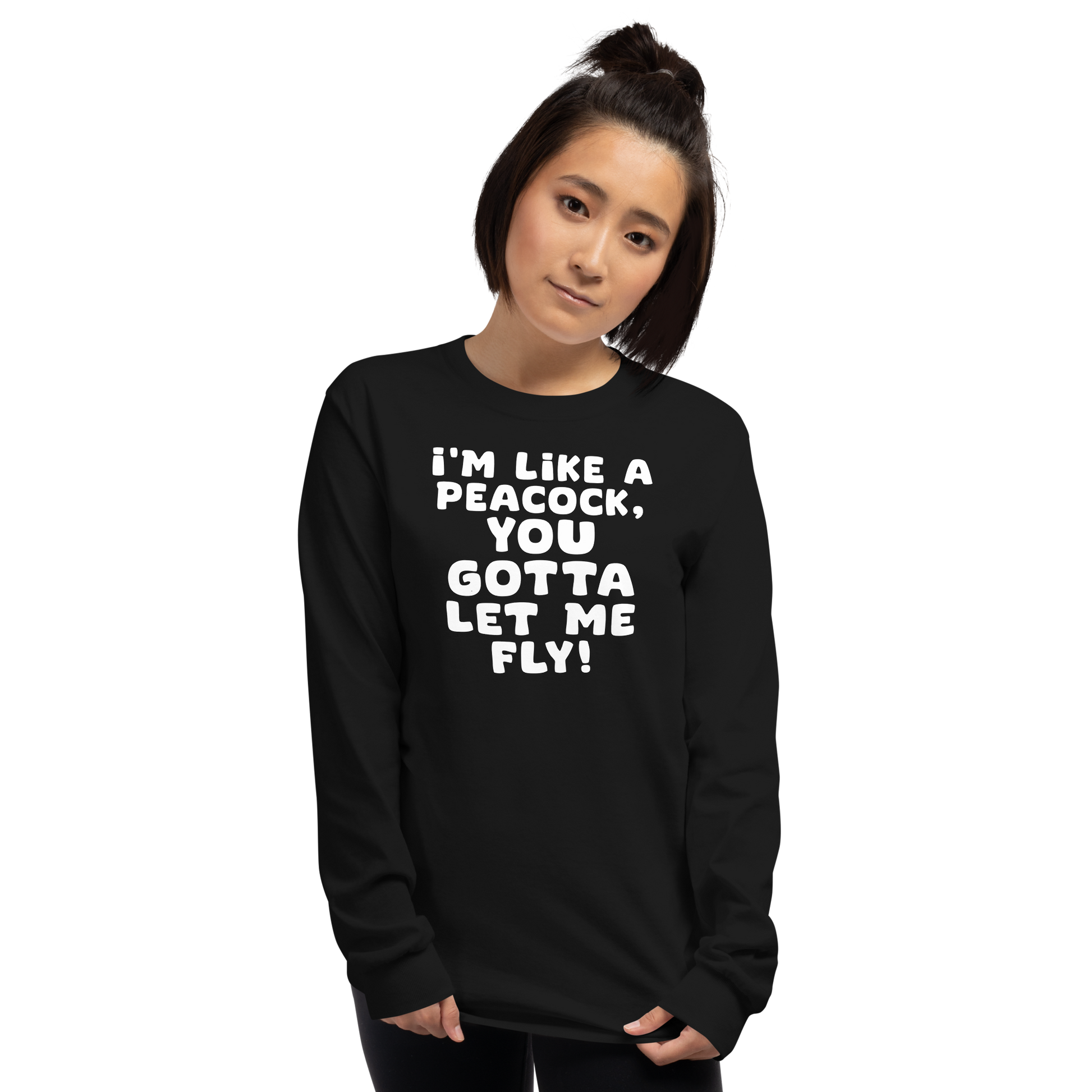 "I'm like a peacock, you gotta let me fly!" printed on a black men's long sleeve shirt worn by a female