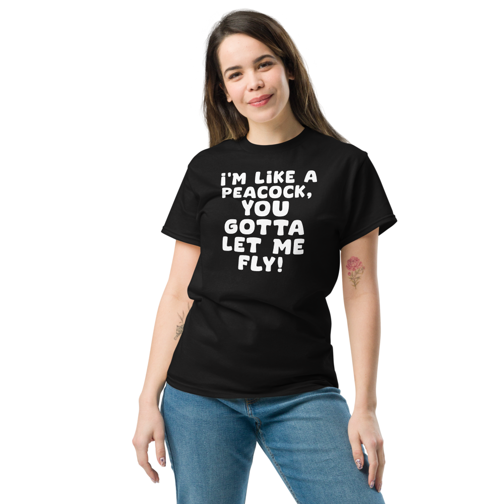 "I'm like a peacock, you gotta let me fly!" printed on a black unisex classic tee worn by a female