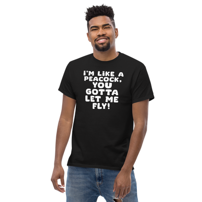 "I'm like a peacock, you gotta let me fly!" printed on a black unisex classic tee worn by a male