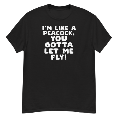 "I'm like a peacock, you gotta let me fly!" printed on a black unisex classic tee laying on a flat surface