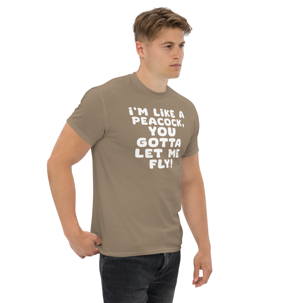 "I'm like a peacock, you gotta let me fly!" printed on a brown savana unisex classic tee worn by a male