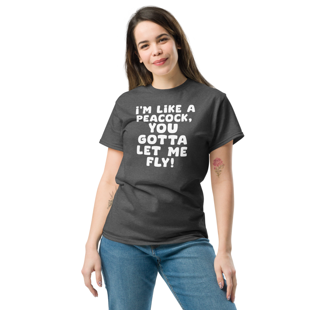 "I'm like a peacock, you gotta let me fly!" printed on a dark heather unisex classic tee worn by a female
