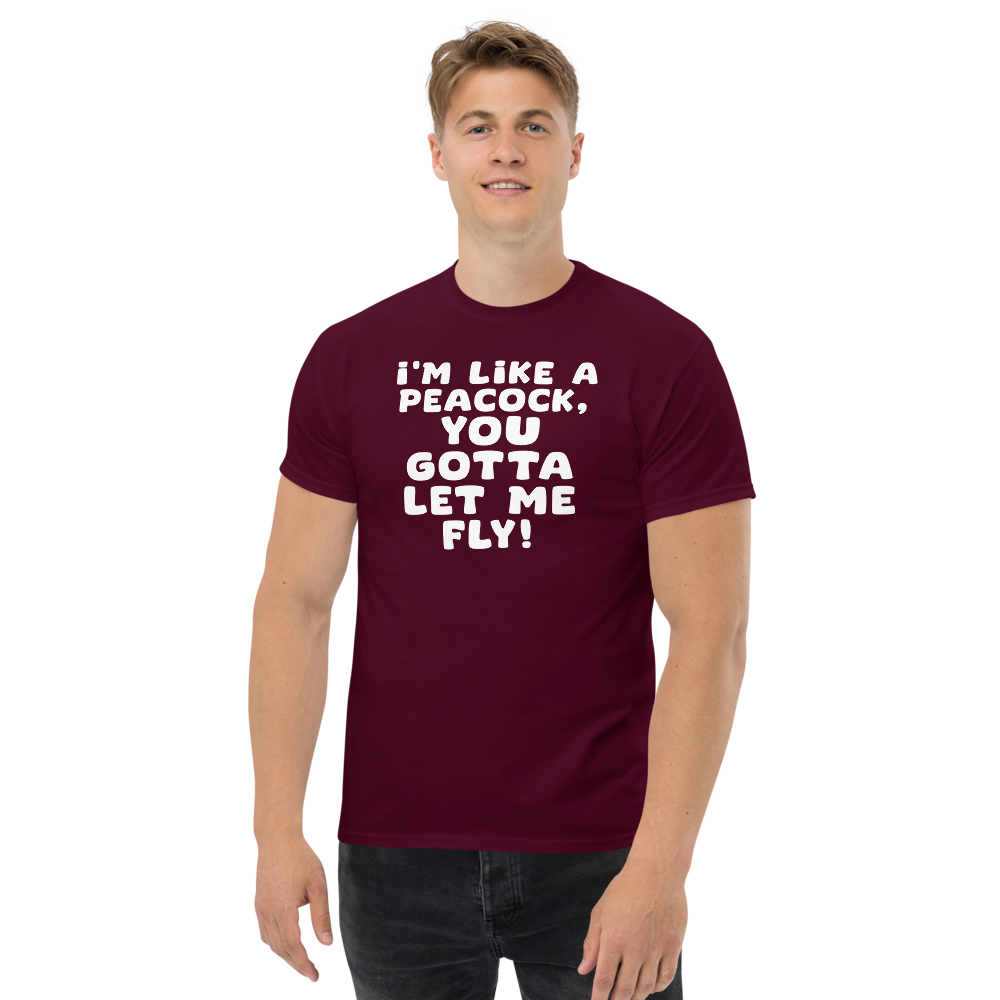 "I'm like a peacock, you gotta let me fly!" printed on a maroon unisex classic tee worn by a male