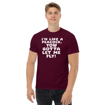 "I'm like a peacock, you gotta let me fly!" printed on a maroon unisex classic tee worn by a male