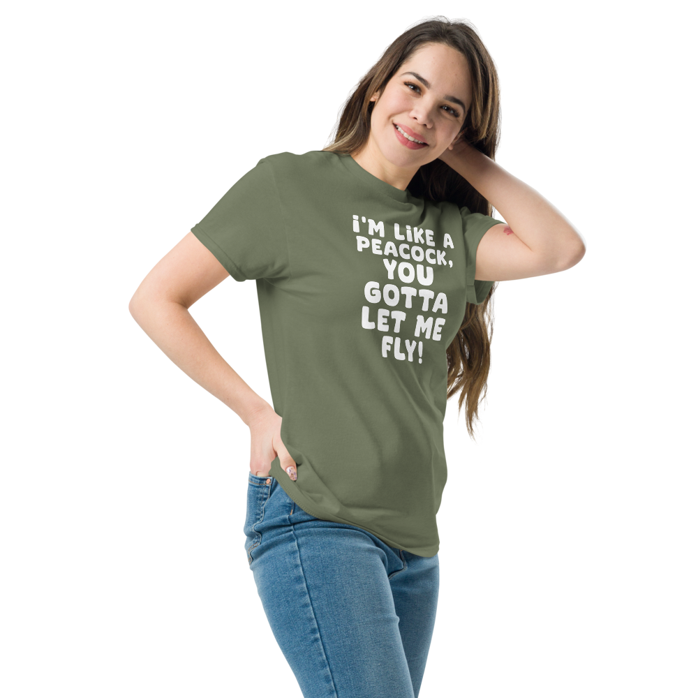 "I'm like a peacock, you gotta let me fly!" printed on a military green unisex classic tee worn by a female
