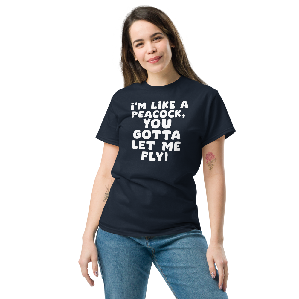"I'm like a peacock, you gotta let me fly!" printed on a navy unisex classic tee worn by a female