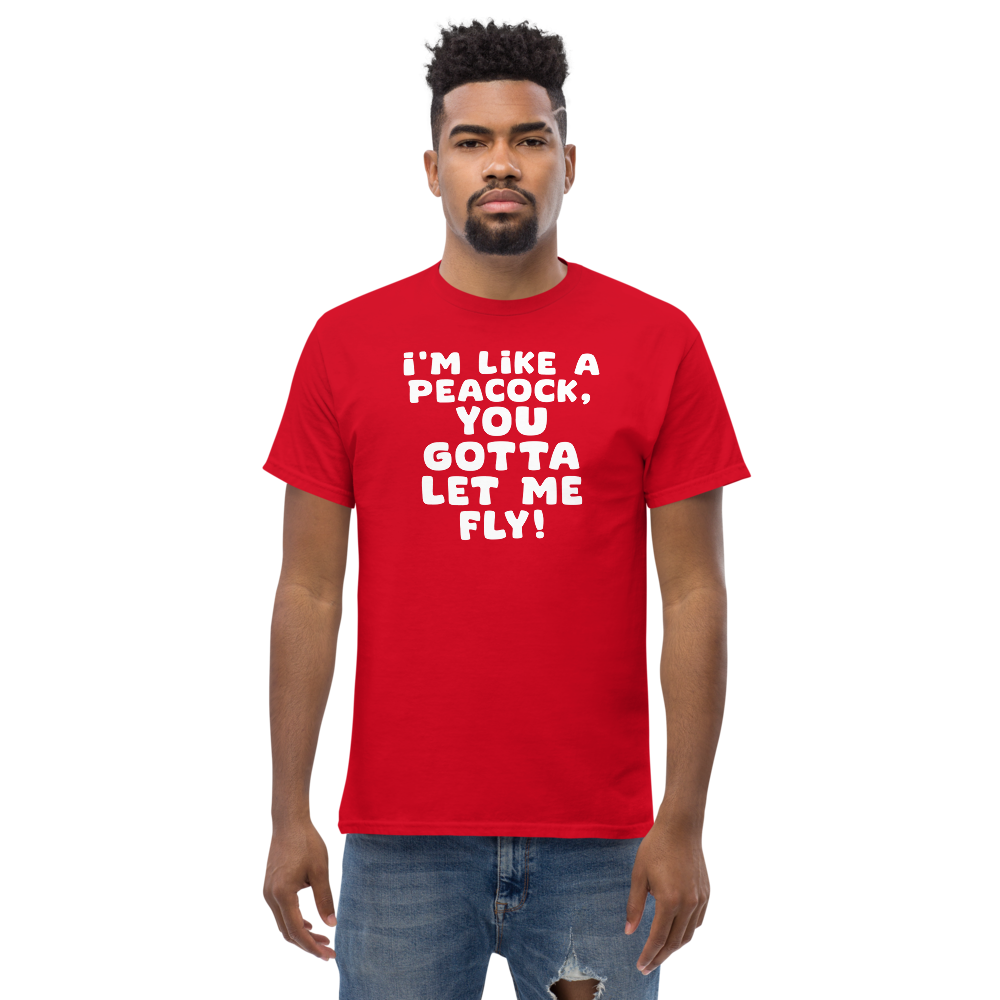 "I'm like a peacock, you gotta let me fly!" printed on a red unisex classic tee worn by a male