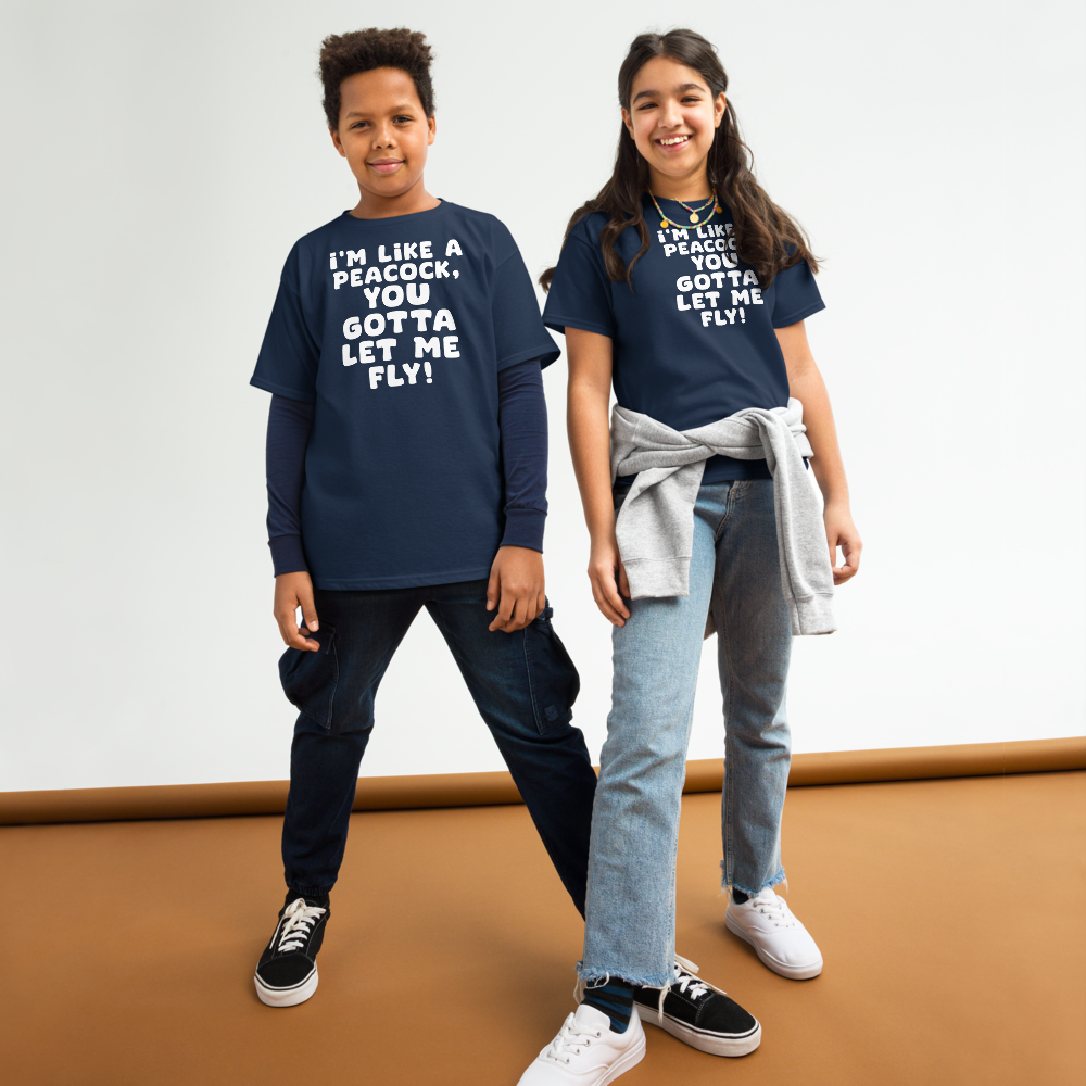 "I'm like a peacock, you gotta let me fly!" printed on a navy youth classic tee worn by a female and male