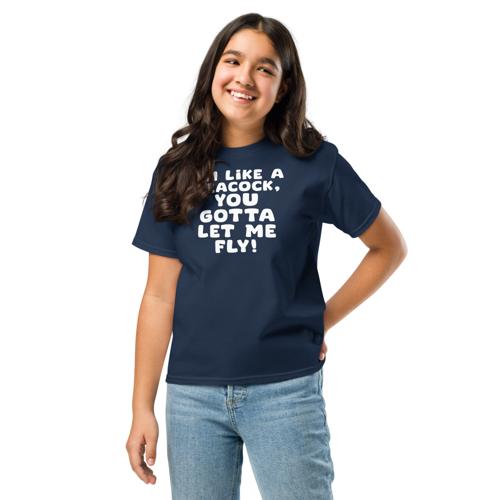 "I'm like a peacock, you gotta let me fly!" printed on a navy youth classic tee worn by a female