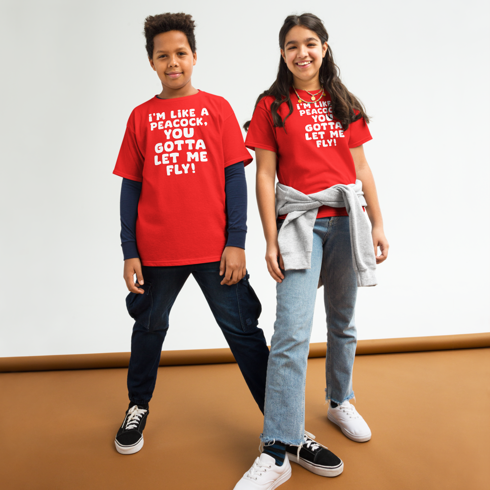 "I'm like a peacock, you gotta let me fly!" printed on a red youth classic tee worn by a female and male