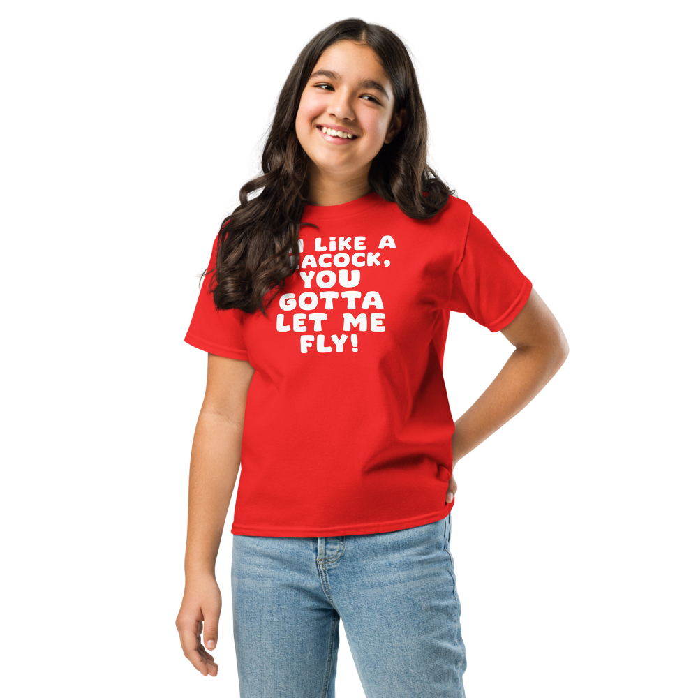 "I'm like a peacock, you gotta let me fly!" printed on a red youth classic tee worn by a female