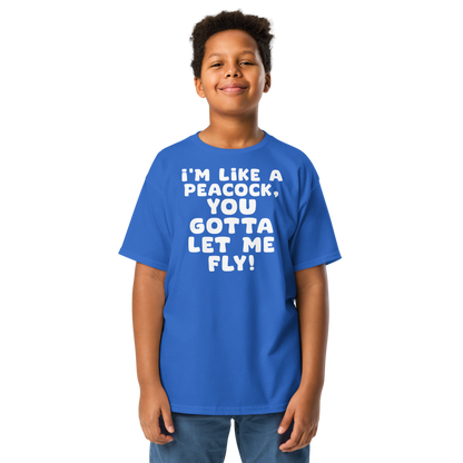 "I'm like a peacock, you gotta let me fly!" printed on a royal youth classic tee worn by a male