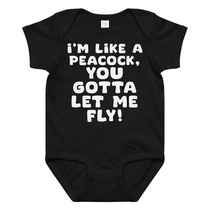 "I'm like a peacock, you gotta let me fly!" printed on a black baby jersey bodysuit laying on a flat surface amongst other clothes