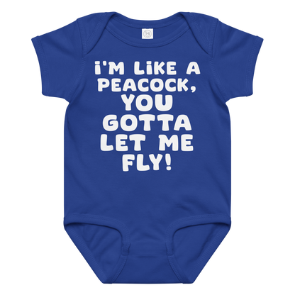 "I'm like a peacock, you gotta let me fly!" printed on a royal baby jersey bodysuit laying on a flat surface amongst other clothes