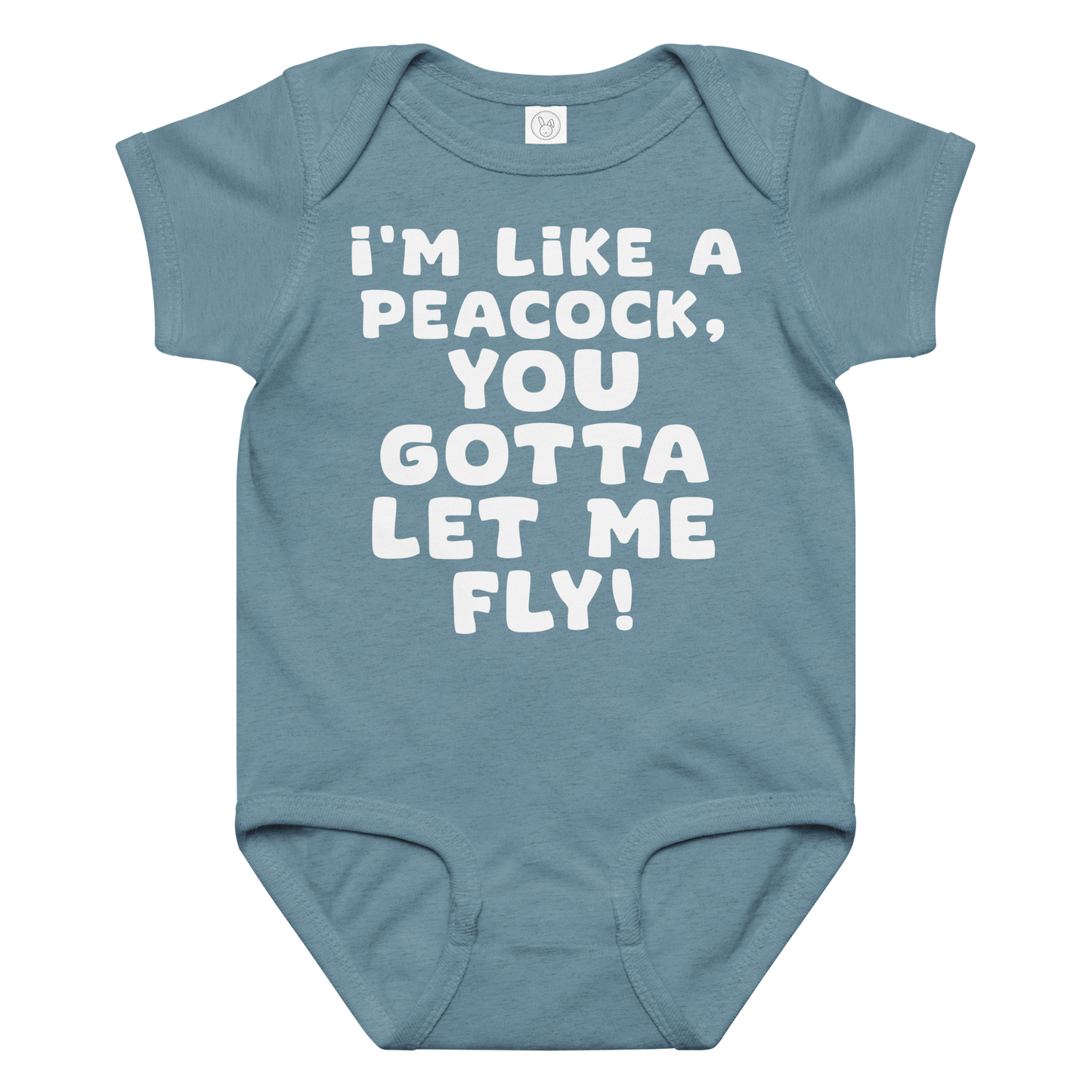 "I'm like a peacock, you gotta let me fly!" printed on a vintage indigo baby jersey bodysuit laying on a flat surface amongst other clothes
