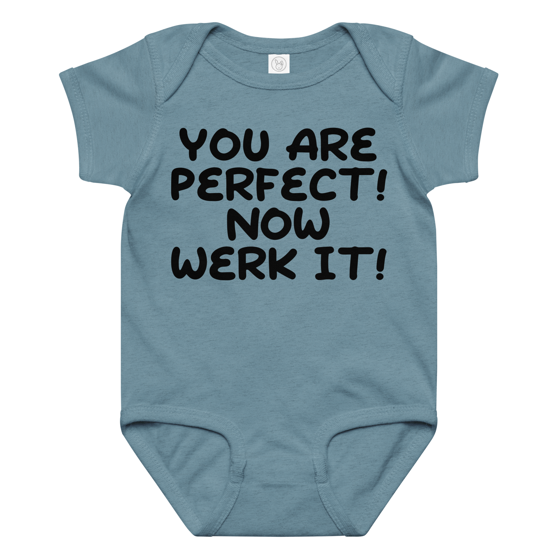 "You Are Perfect! Now Werk It!" printed on a vintage indigo baby jersey bodysuit laying on a flat surface amongst other clothes
