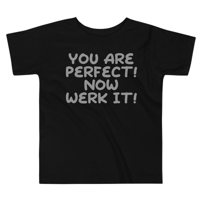 "You Are Perfect! Now Werk It!" printed on a black toddler short sleeve tee laying on a flat surface
