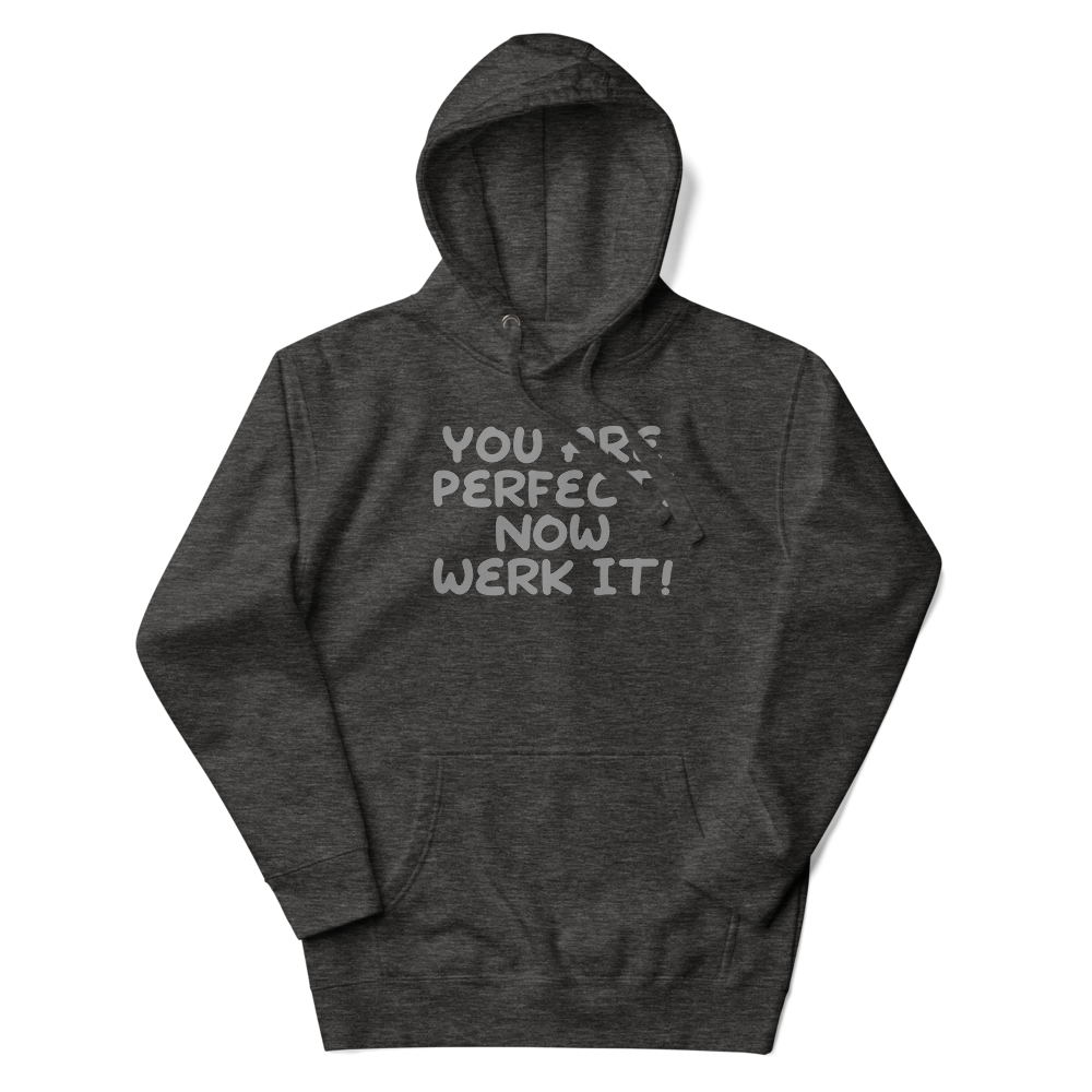 "You Are Perfect! Now Werk It!" printed on a charcoal heather unisex hoodie laying on a flat surface with the hood up