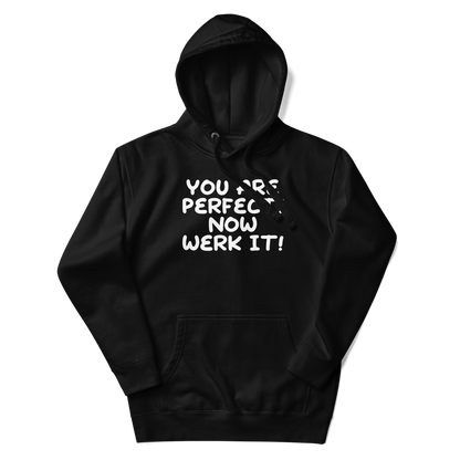 "You Are Perfect! Now Werk It!" printed on a black unisex hoodie laying on a flat surface with the hood up