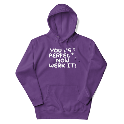 "You Are Perfect! Now Werk It!" printed on a purple unisex hoodie laying on a flat surface with the hood up