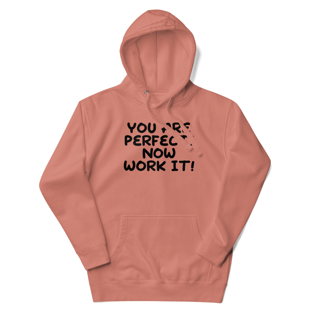 "You Are Perfect! Now Work It!" printed on a dusty rose unisex hoodie laying on a flat surface with the hood up