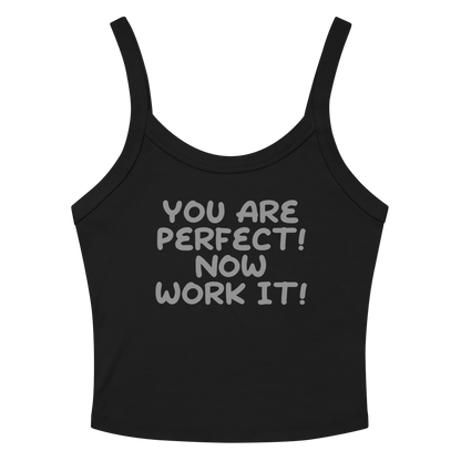 "You Are Perfect! Now Work It!" printed on a solid black blend women's micro-rib tanktop laying on a flat surface amongst sunglasses and shorts