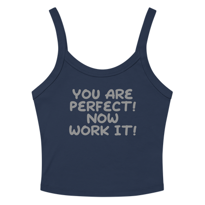 "You Are Perfect! Now Work It!" printed on a solid navy blend women's micro-rib tanktop laying on a flat surface amongst sunglasses and shorts
