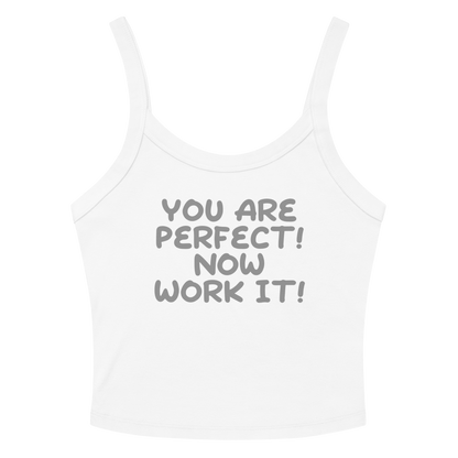 "You Are Perfect! Now Work It!" printed on a solid white blend women's micro-rib tanktop laying on a flat surface amongst sunglasses and shorts