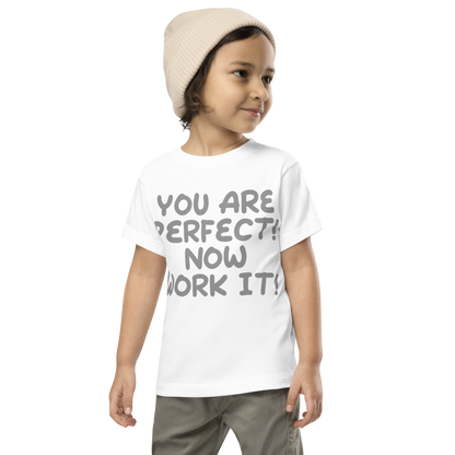 "You Are Perfect! Now Work It!" printed on a white toddler short sleeve tee worn by a male wearing a cap
