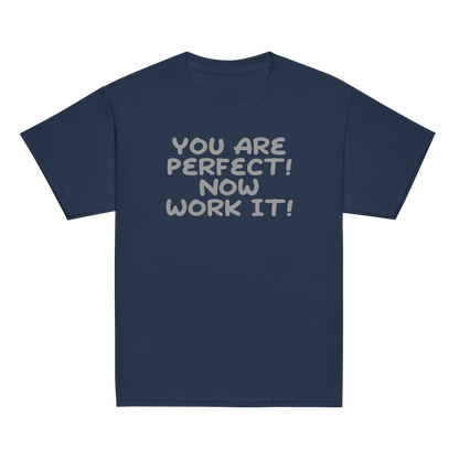 "You Are Perfect! Now Work It!" printed on a navy youth classic tee laying on a flat surface
