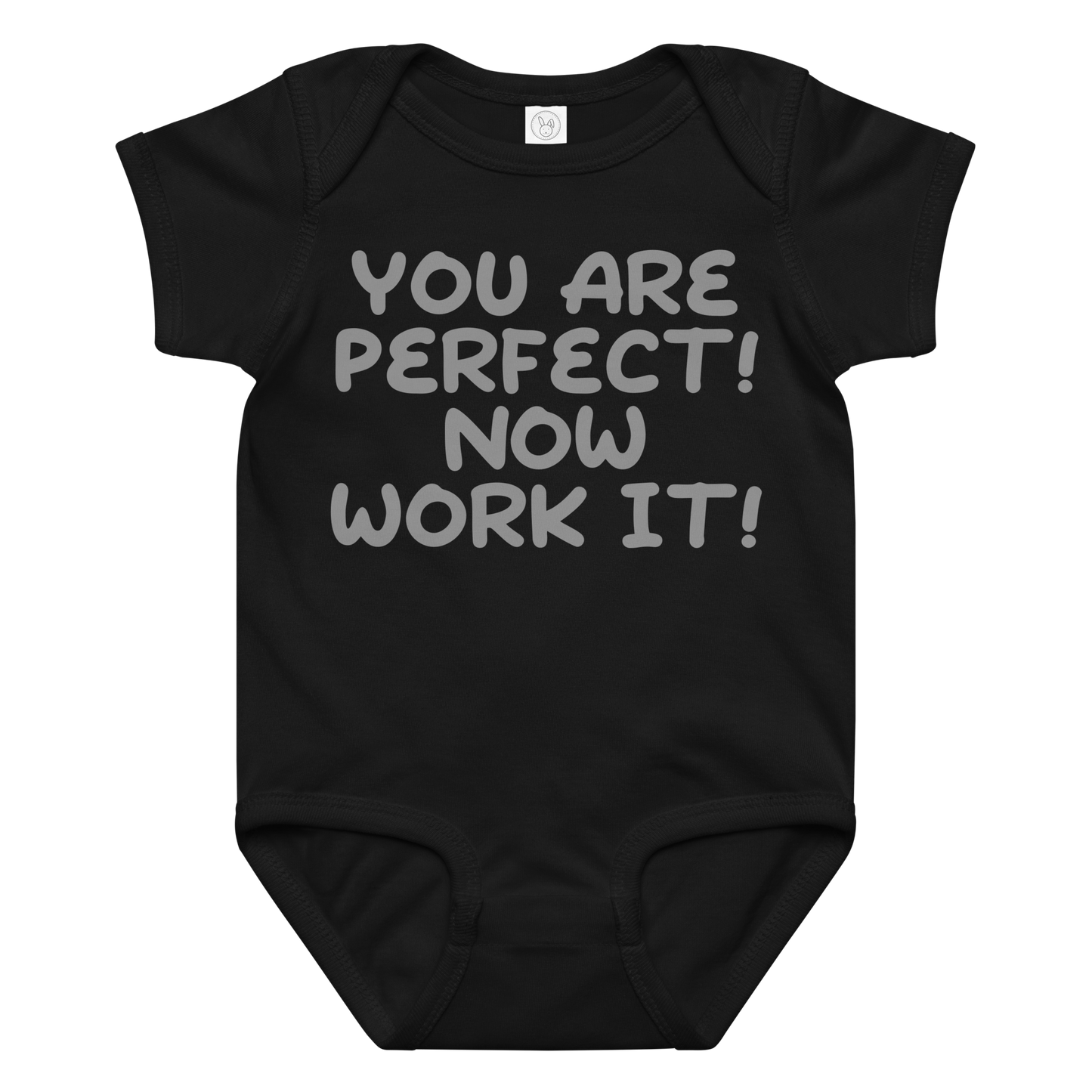 "You Are Perfect! Now Work It!" printed on a black baby jersey bodysuit laying on a flat surface amongst other clothes