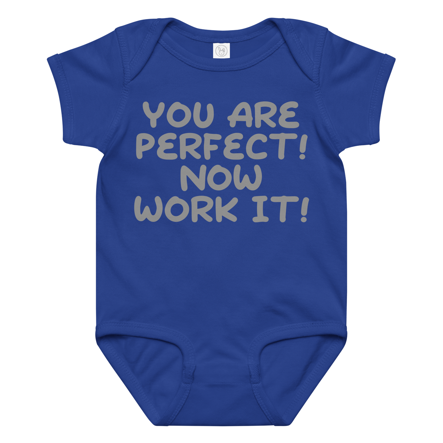 "You Are Perfect! Now Work It!" printed on a royal baby jersey bodysuit laying on a flat surface amongst other clothes