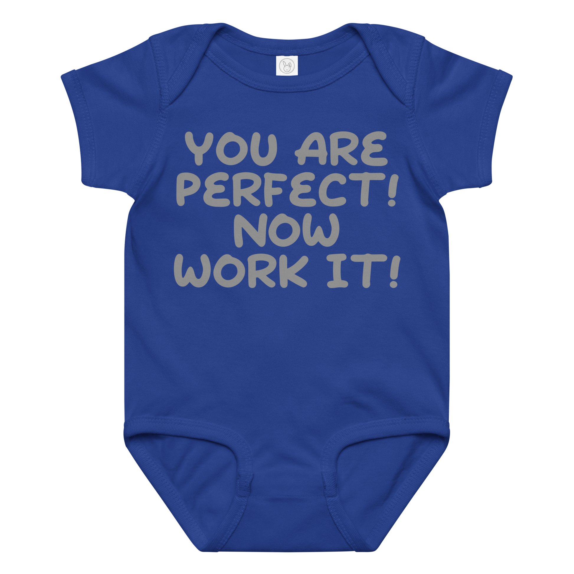 "You Are Perfect! Now Work It!" printed on a royal baby jersey bodysuit laying on a flat surface amongst other clothes