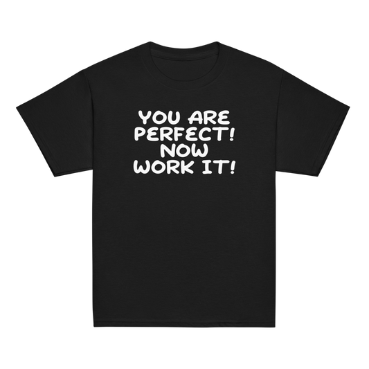 "You Are Perfect! Now Work It!" printed on a black youth classic tee laying on a flat surface