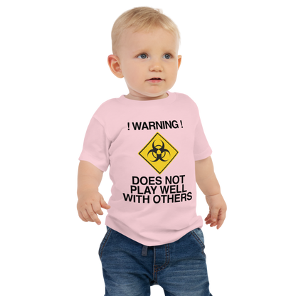 "!Warning! Does Not Play Well With Others" printed on a pink baby jersey short sleeve tee worn by a male