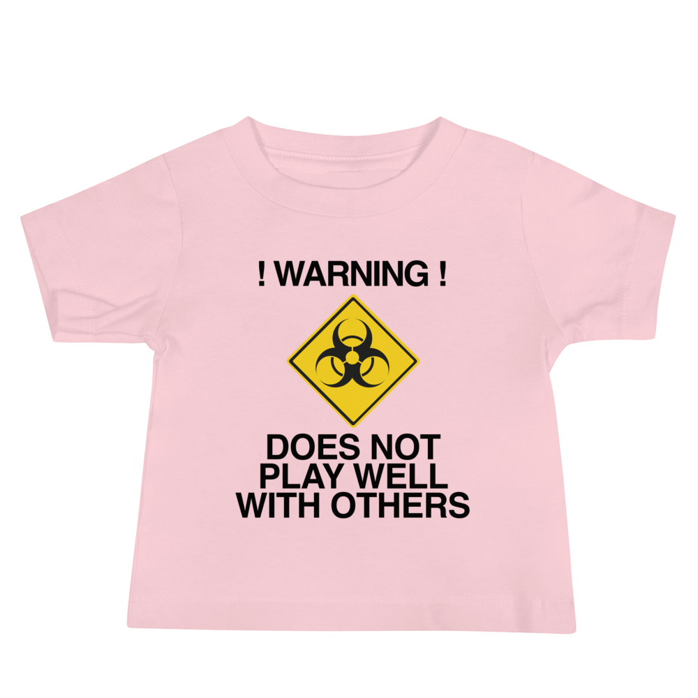 "!Warning! Does Not Play Well With Others" printed on a pink baby jersey short sleeve tee laying on a flat surface