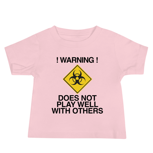"!Warning! Does Not Play Well With Others" printed on a pink baby jersey short sleeve tee laying on a flat surface