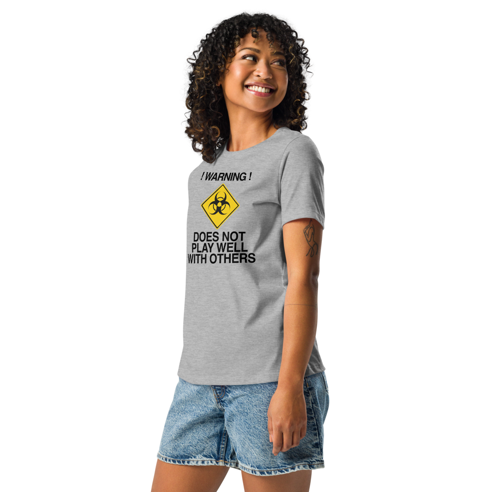"!Warning! Does Not Play Well With Others" printed on a athletic heather women's relaxed t-shirt worn by a female