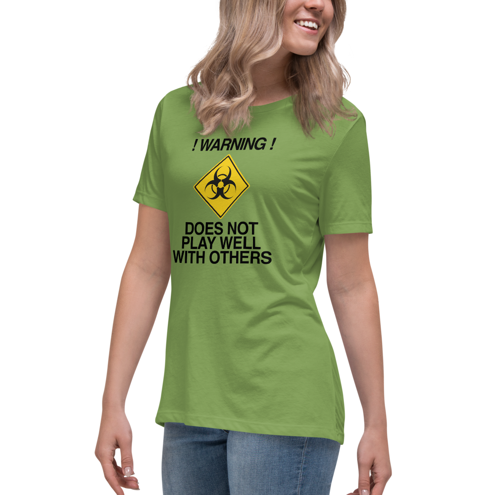 "!Warning! Does Not Play Well With Others" printed on a leaf women's relaxed t-shirt worn by a female