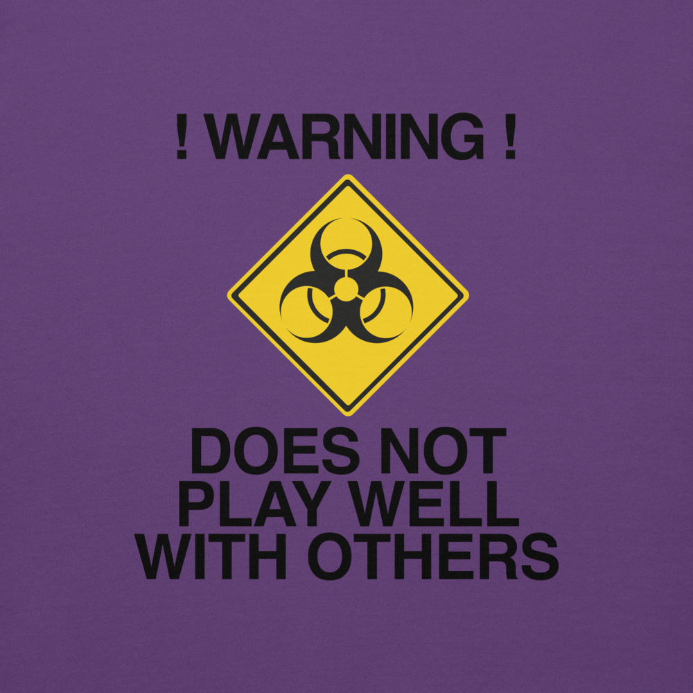 "!Warning! Does Not Play Well With Others" printed on a purple background