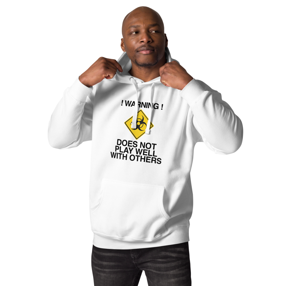 "!Warning! Does Not Play Well With Others" printed on a white unisex hoodie worn by a male