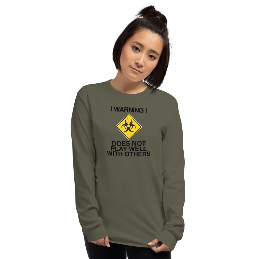 "!Warning! Does Not Play Well With Others" printed on a military green men's long sleeve shirt worn by a female