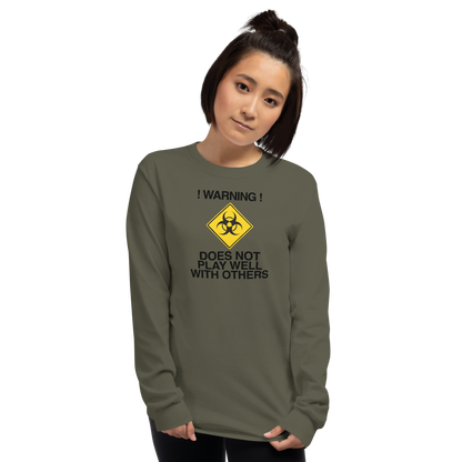 "!Warning! Does Not Play Well With Others" printed on a military green men's long sleeve shirt worn by a female