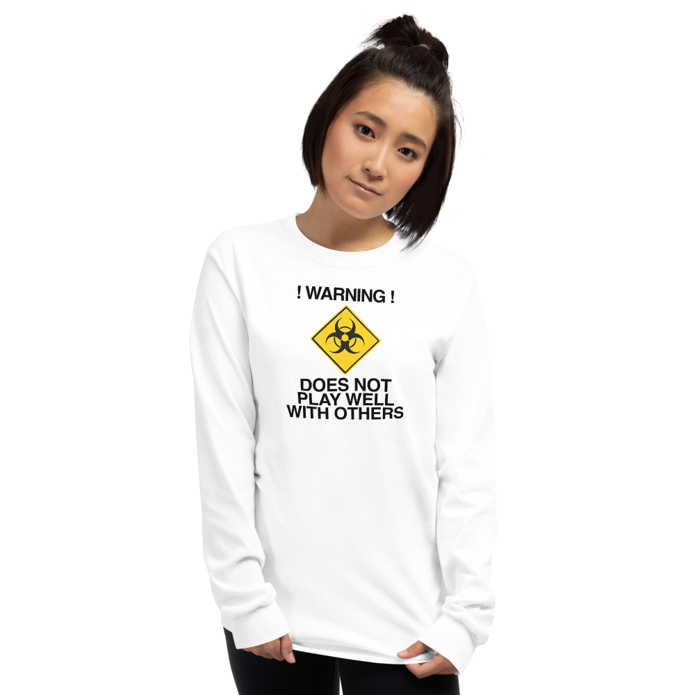 "!Warning! Does Not Play Well With Others" printed on a white men's long sleeve shirt worn by a female