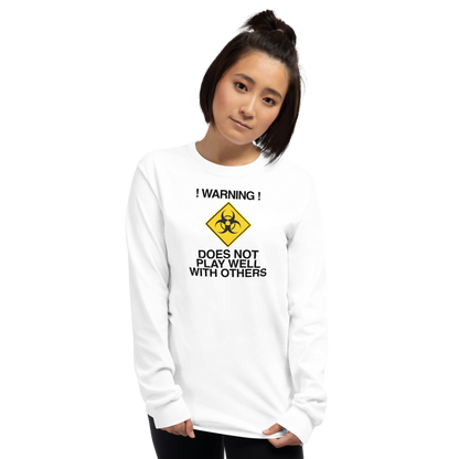 "!Warning! Does Not Play Well With Others" printed on a white men's long sleeve shirt worn by a female