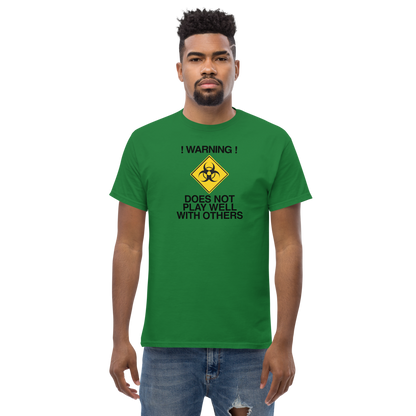 "!Warning! Does Not Play Well With Others" printed on a turf green unisex classic tee worn by a male
